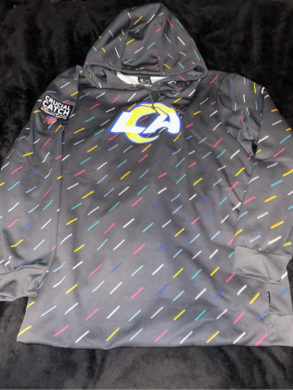 NFL Crucial Catch Black Pullover Hoodie with Multicolor Dash Accents